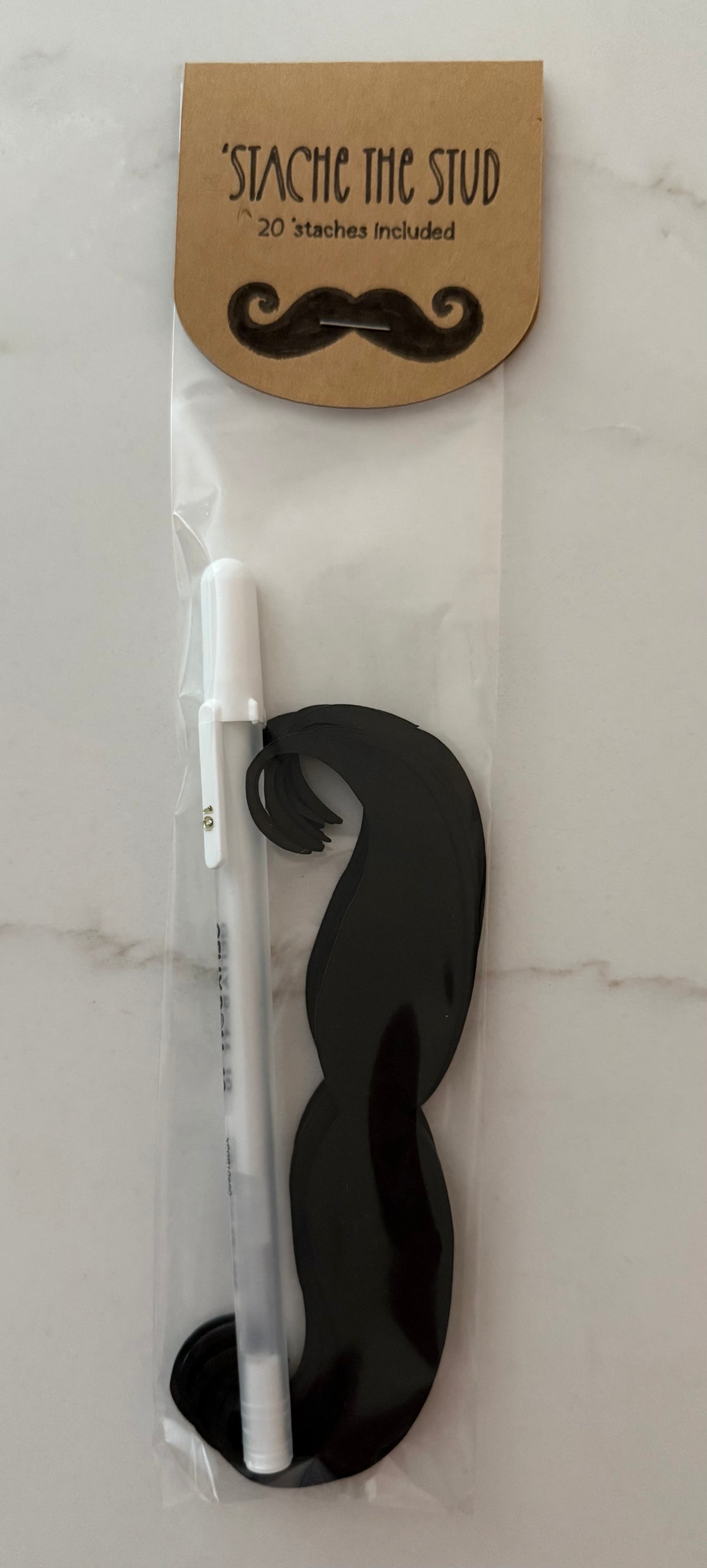 Each game includes a white gel pen for writing names on the 'staches, and 20 'staches for play. Extra 'staches are available and sold separately.